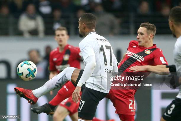 Leverkusen's Dominik Kohr and Frankfurt's Kevin-Prince Boateng vie for the ball during the German Bundesliga soccer match between Eintracht Frankfurt...