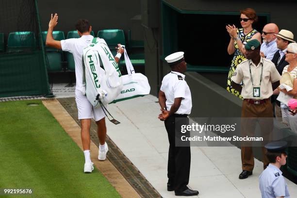 Marin Cilic of Croatia waves to the crowd after being Guido Pella of Argentina in their Men's Singles second round match on day four of the Wimbledon...