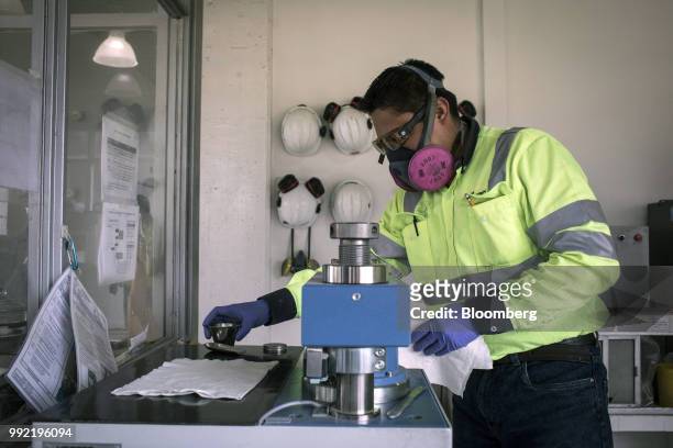 Worker tests cement samples at the laboratory of the Cemex Latam Holdings SA production facility in La Calera, Cundinamarca department, Colombia, on...