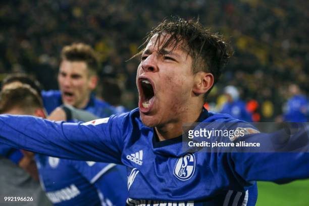 Schalke's Amine Harit celebrates his 4-4 equalizing score during the German Bundesliga soccer match between Borussia Dortmund and Schalke 04 at the...
