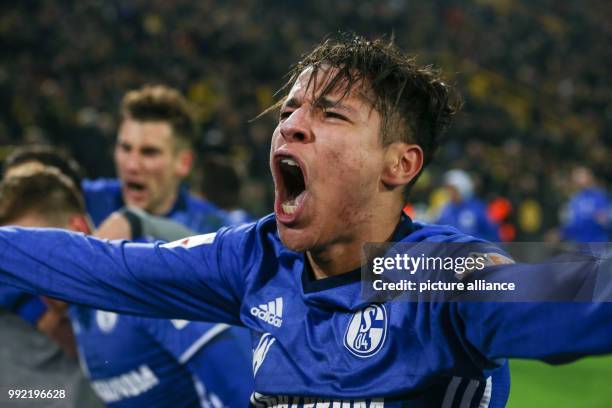 Schalke's Amine Harit celebrates the 4-4 equalizing score during the German Bundesliga soccer match between Borussia Dortmund and Schalke 04 at the...