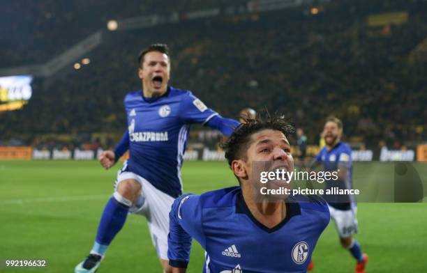 Schalke's Amine Harit celebrates his 4-4 equalizing score during the German Bundesliga soccer match between Borussia Dortmund and Schalke 04 at the...