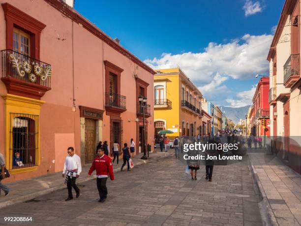 people walking on calle alcala, a pedestrian street in center oaxaca city mexico - calle stockfoto's en -beelden