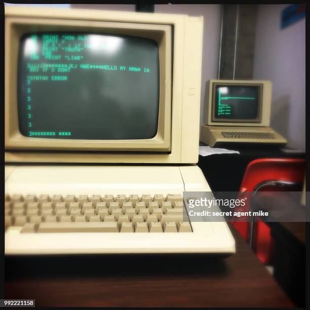 ancient computers in classroom - mainframe stock-fotos und bilder