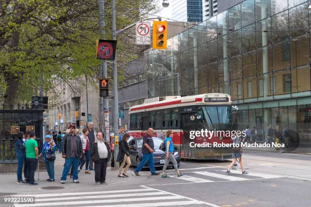 toronto canada: obsolete streetcar and daily life in queen street west and university avenue - ttc stock pictures, royalty-free photos & images