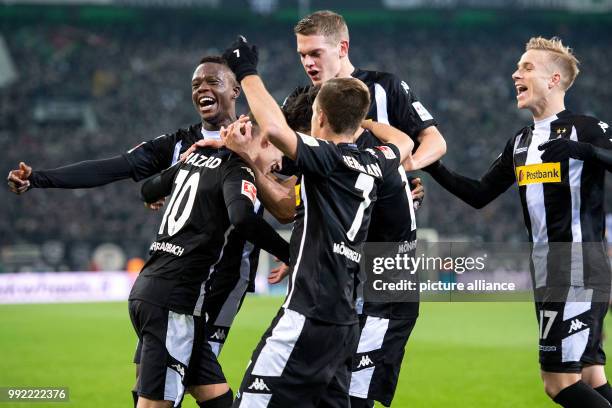 Gladbach's Denis Zakaria , scorer Thorgan Hazard, Patrick Herrmann, Matthias Ginter and Oscar Wendt cheer over the 1-0 score during the German...