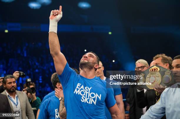 German Manuel Charr celebrates while the referee announces his the winner of the WBA World Championship Heavyweight in Oberhausen, Germany, 25...