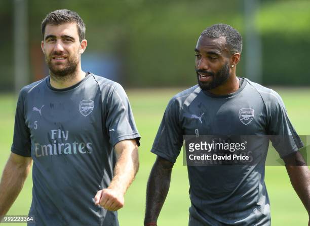 Sokratis Papastathopoulos and Alexandre Lacazette of Arsenal during pre-season training session at London Colney on July 5, 2018 in St Albans,...