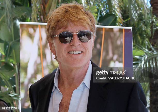 Actor Robert Redford poses during a photocall of the 26th edition of the five-days MIPCOM on October 06, 2010 in Cannes, southern France. Redford,...