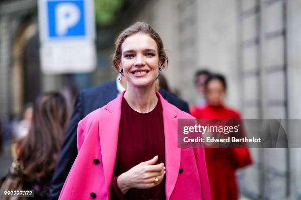 Natalia Vodianova wears a pink blazer jacket, a burgundy red dress, outside Valentino, during Paris Fashion Week Haute Couture Fall Winter 2018/2019,...