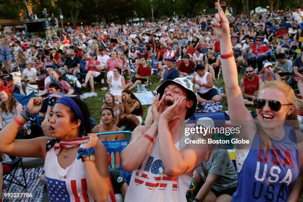 From left, Jocelyn Wang, Henry Ross and Isabella Collins cheer for Rhiannon Giddens during the opening of the Boston Pops Fireworks Spectacular at...