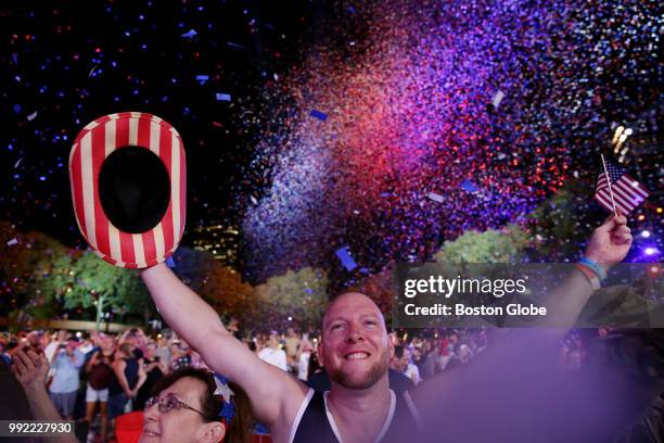 Scott Webb enjoys the festivities at the end of the Boston Pops Fireworks Spectacular at the Hatch Shell on the Esplanade in Boston, MA on July 04,...