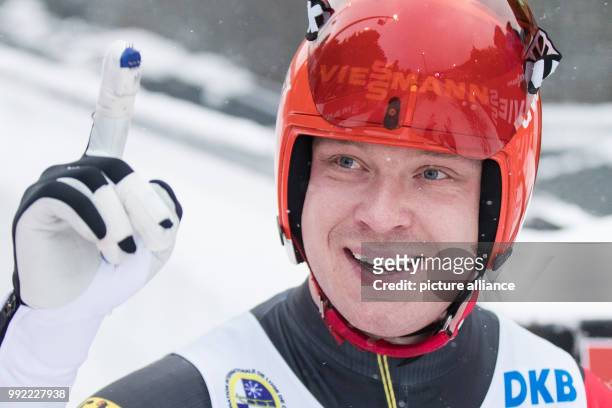 Germany's Felix Loch celebrates his victory the Men's Singles racce event of the Luge World Cup in Winterberg, Germany, 26 November 2017. Photo:...