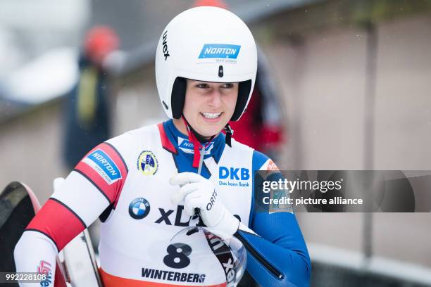 America's Emily Sweeney smiles during the women's singles race event at the Luge World Cup in Winterberg, Germany, 26 November 2017. Sweeney won...