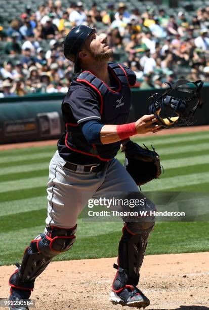 Yan Gomes of the Cleveland Indians reacts to a foul pop-up off the bat of Marcus Semien of the Oakland Athletics in the fifth inning at Oakland...