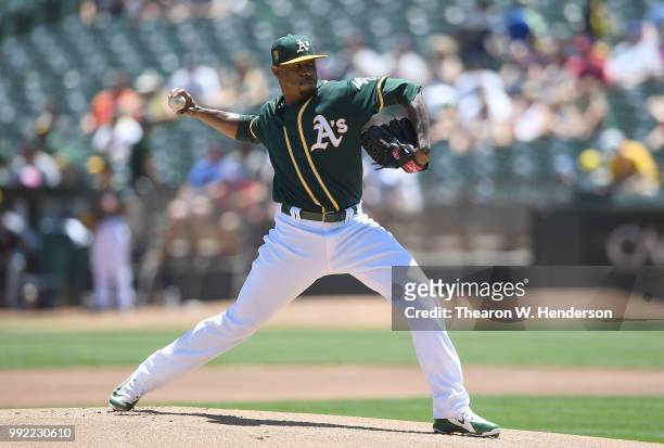 Edwin Jackson of the Oakland Athletics pitches against the Cleveland Indians in the top of the first inning at Oakland Alameda Coliseum on June 30,...