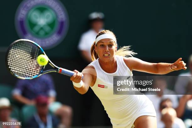 Dominika Cibulkova of Slovakia returns a shot against Johanna Konta of Great Britain during their Ladies' Singles second round match on day four of...