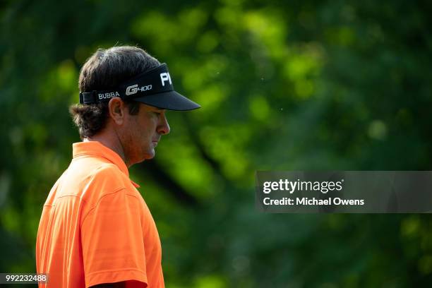 Bubba Watson walks to his second shot on the 12th hole during round one of A Military Tribute At The Greenbrier at the Old White TPC course on July...