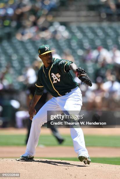 Edwin Jackson of the Oakland Athletics pitches against the Cleveland Indians in the top of the first inning at Oakland Alameda Coliseum on June 30,...