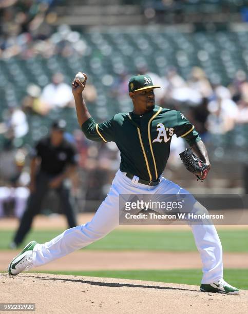 Edwin Jackson of the Oakland Athletics pitches against the Cleveland Indians in the top of the first inning at Oakland Alameda Coliseum on June 30,...