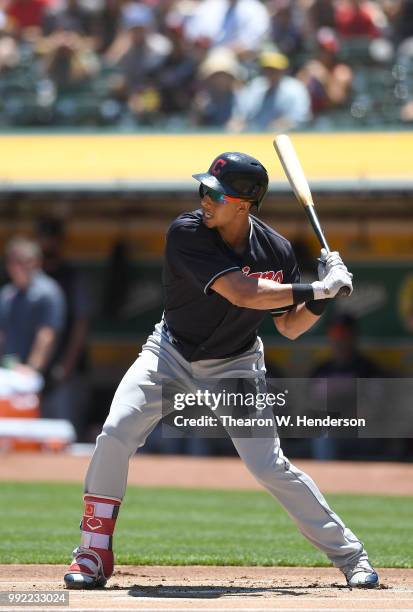 Michael Brantley of the Cleveland Indians bats against the Oakland Athletics in the first inning at Oakland Alameda Coliseum on June 30, 2018 in...