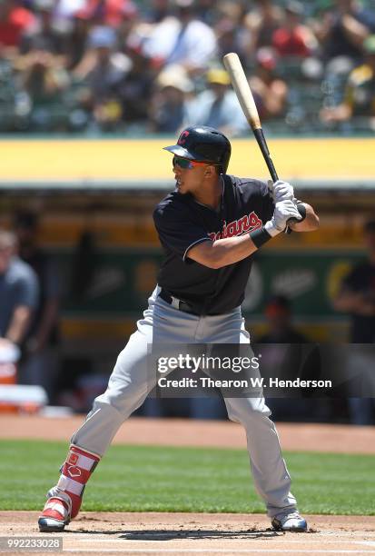 Michael Brantley of the Cleveland Indians bats against the Oakland Athletics in the first inning at Oakland Alameda Coliseum on June 30, 2018 in...