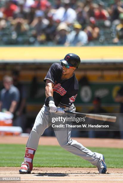 Michael Brantley of the Cleveland Indians bats against the Oakland Athletics in the first inning at Oakland Alameda Coliseum on June 30, 2018 in...