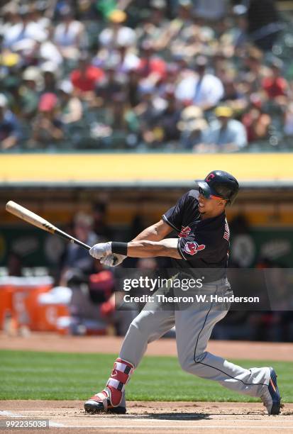 Michael Brantley of the Cleveland Indians bats against the Oakland Athletics in the first inning at Oakland Alameda Coliseum on June 30, 2018 in...