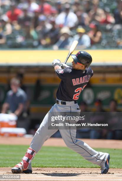 Michael Brantley of the Cleveland Indians bats against the Oakland Athletics in the first inning at Oakland Alameda Coliseum on June 30, 2018 in...