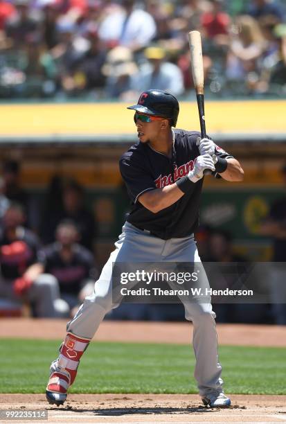 Michael Brantley of the Cleveland Indians bats against the Oakland Athletics in the first inning at Oakland Alameda Coliseum on June 30, 2018 in...