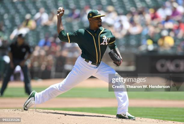 Edwin Jackson of the Oakland Athletics pitches against the Cleveland Indians in the top of the first inning at Oakland Alameda Coliseum on June 30,...