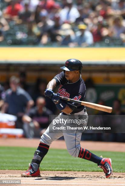 Jose Ramirez of the Cleveland Indians bats against the Oakland Athletics in the first inning at Oakland Alameda Coliseum on June 30, 2018 in Oakland,...