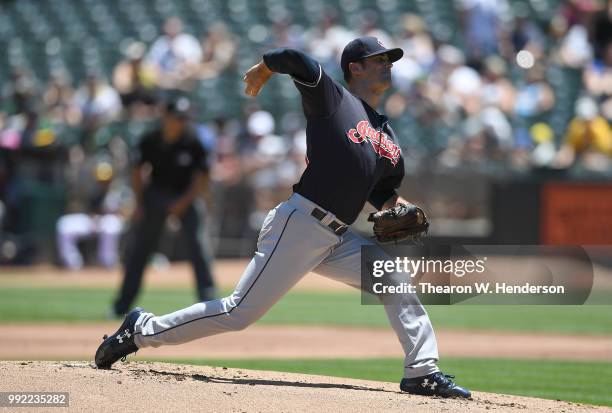 Adam Plutko of the Cleveland Indians pitches against the Oakland Athletics in the bottom of the first inning at Oakland Alameda Coliseum on June 30,...