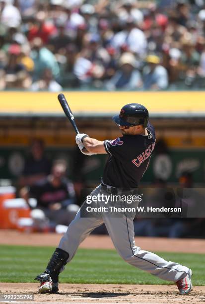 Lonnie Chisenhall of the Cleveland Indians bats against the Oakland Athletics in the second inning at Oakland Alameda Coliseum on June 30, 2018 in...