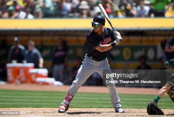 Michael Brantley of the Cleveland Indians bats against the Oakland Athletics in the fourth inning at Oakland Alameda Coliseum on June 30, 2018 in...