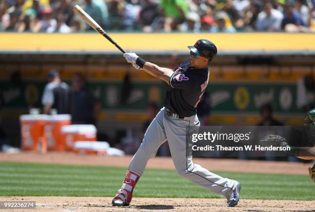 Michael Brantley of the Cleveland Indians bats against the Oakland Athletics in the fourth inning at Oakland Alameda Coliseum on June 30, 2018 in...