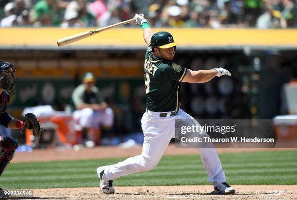 Josh Phegley of the Oakland Athletics bats against the Cleveland Indians in the bottom of the six inning at Oakland Alameda Coliseum on June 30, 2018...