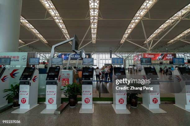 Self-checkin machine in Xi'an Xianyang international airport. The China Eastern Airlines Co is a state-owned holding airline based in Shanghai,...