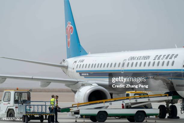 China Southern airlines airplane stops on the airport apron, accepting ground service before next taking off. China Southern Airlines, based in...