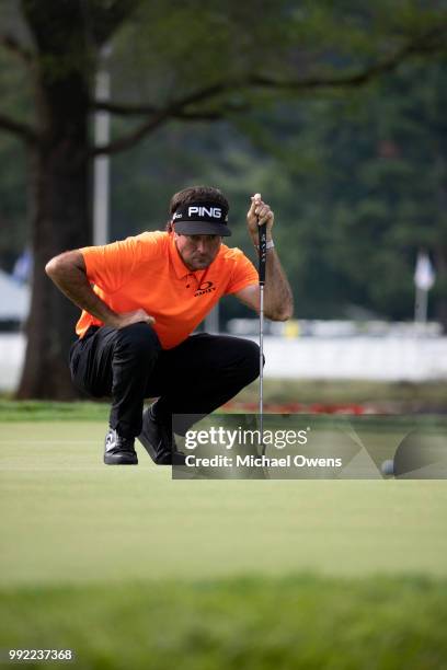 Bubba Watson lines up his par putt during round one of A Military Tribute At The Greenbrier at the Old White TPC course on July 5, 2018 in White...