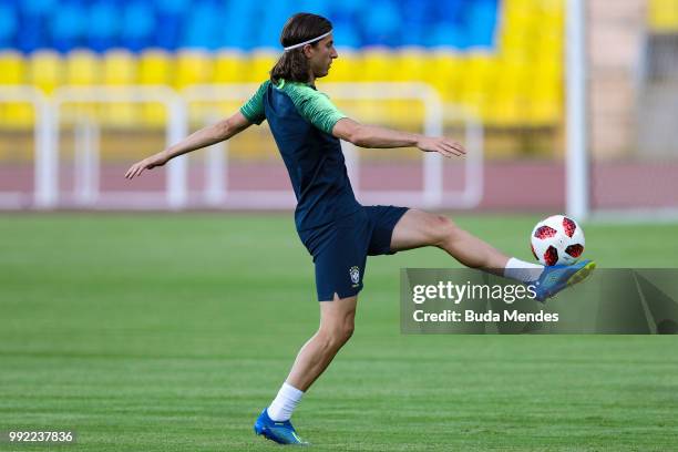 Filipe Luis controls the ball during a Brazil training session ahead of the the 2018 FIFA World Cup Russia Quarter Final match between Brazil and...