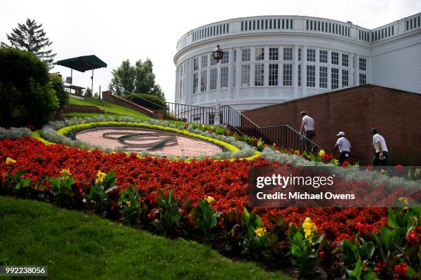 Ollie Schniederjans, Harold Varner III and Keegan Bradley walk to the first hole tee box during round one of A Military Tribute At The Greenbrier at...