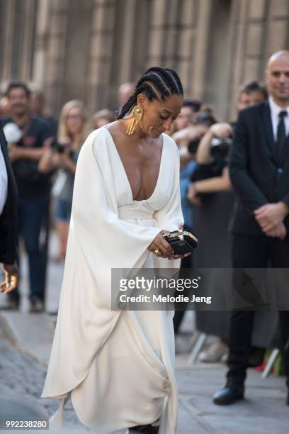Tracee Ellis Ross attends Valentino in a white dress and gold earrings on July 4, 2018 in Paris, France.