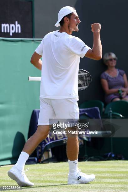 Bernard Tomic of Australia celebrates a point against Kei Nishikori of Japan during their Men's Singles second round match on day four of the...