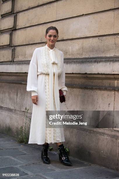 Sofia Sanchez de Betak attends Valentino in a white dress, on July 4, 2018 in Paris, France.