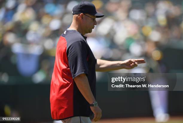 Manager Terry Francona of the Cleveland Indians signals the bullpen to make a pitching change against the Oakland Athletics in the bottom of the six...