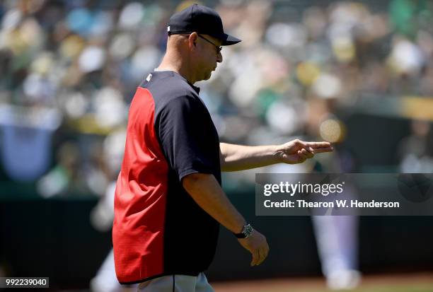 Manager Terry Francona of the Cleveland Indians signals the bullpen to make a pitching change against the Oakland Athletics in the bottom of the six...