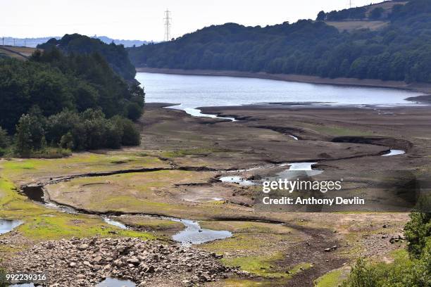 General view of low water levels in Bottoms Reservoir, one of the Longendale Reservoirs near Tintwistle in the High Peak on July 5, 2018 in...