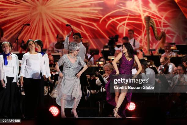 Rita Moreno, left, and Natalie Cortez, right, perform with the Tanglewood Festival Chorus and Boston Pops Orchestra during the Boston Pops July 4th...