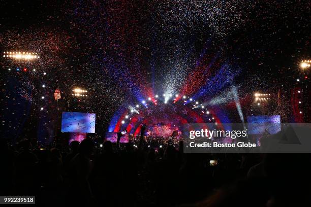 Confetti falls onto the crowd during the Boston Pops July 4th Fireworks Spectacular in Boston on July 4, 2018.